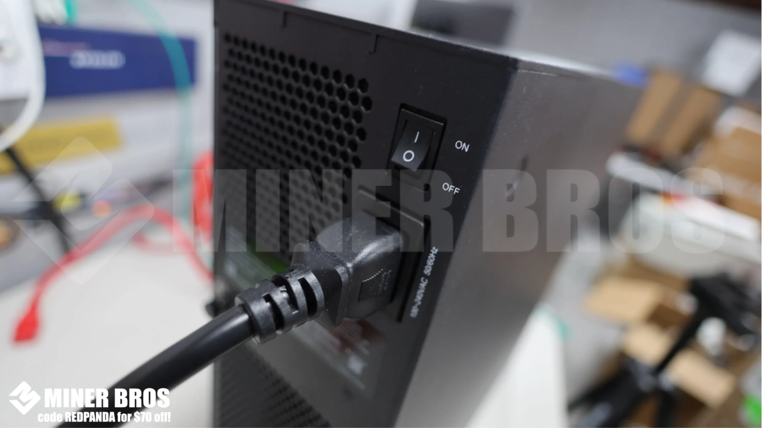 Insert the C19 power cable into the power socket at the rear.